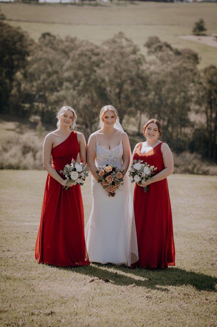 Rust bridesmaids dresses in chiffon with wedding dress